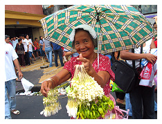 fragrant sampaguita buds are strewn into delicate necklaces to hang around your favorite holy statue